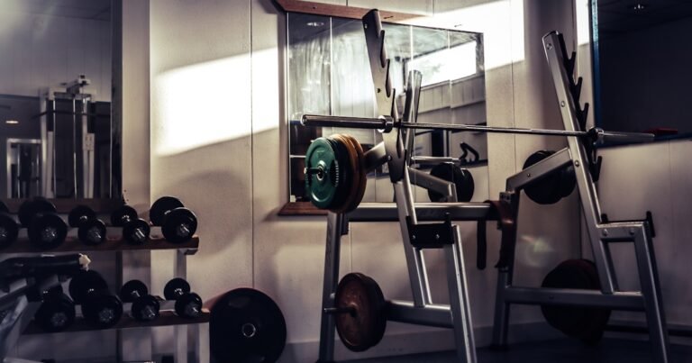 Rubber gym floor tiles installed in a home garage gym